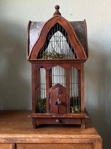 Antique folk bird cage with zinc roof and base